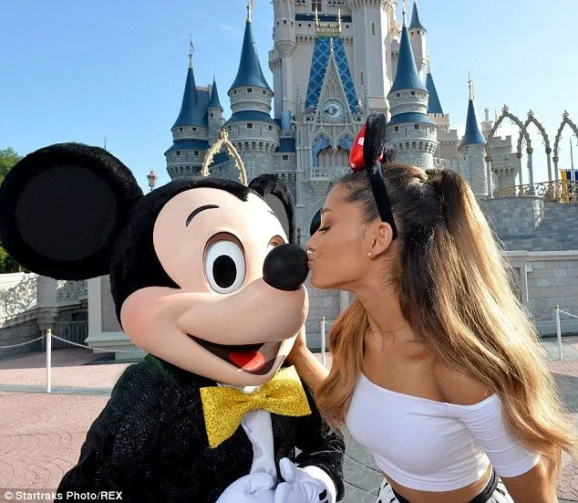 Ariana Grande kisses Mickey Mouse as she celebrates turning 21 at ...