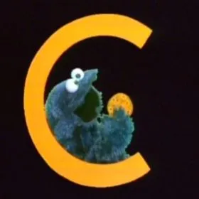 Cookie Monster singing his signature song 