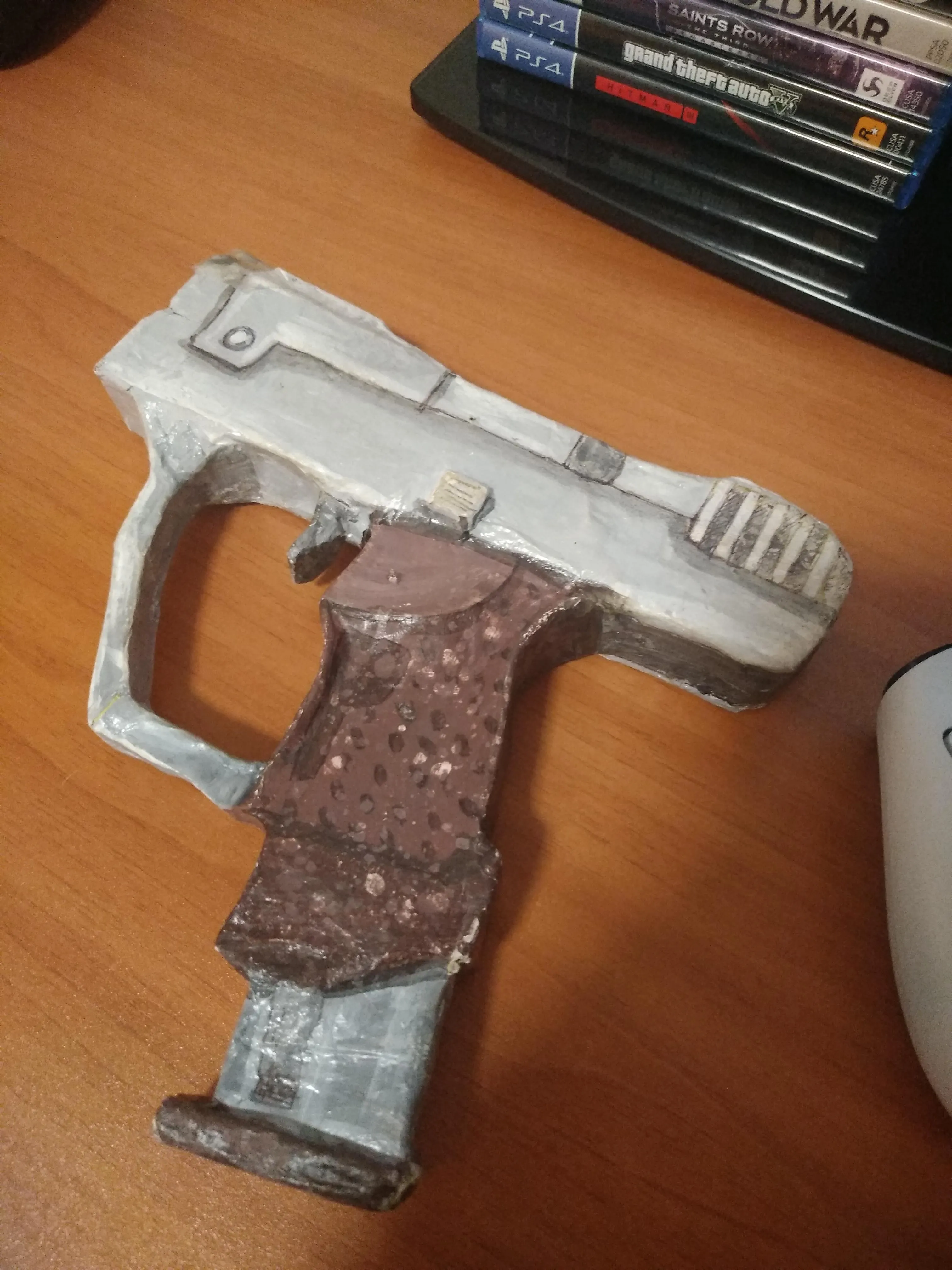 i made this Papercraft of the Magnum from Halo CE 2 year ago i was in art  class i still remember how hard was to make this piece of art 