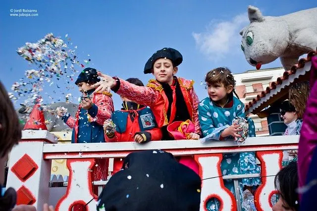 Parade costumes and confetti in the traditional carnival of ...