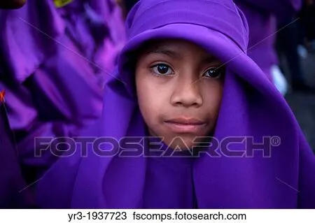 Stock Photo of A boy dressed as a penitent participates in the ...