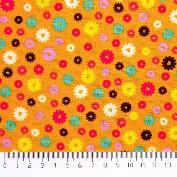 Tela patchwork: flores de colores sobre naranja